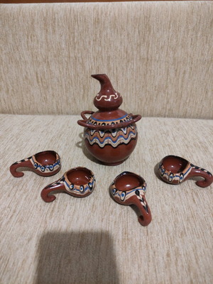 Clay jug used with four glasses