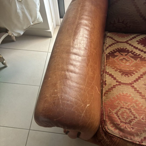 Kourtis armchair used with leather arms in brown tones