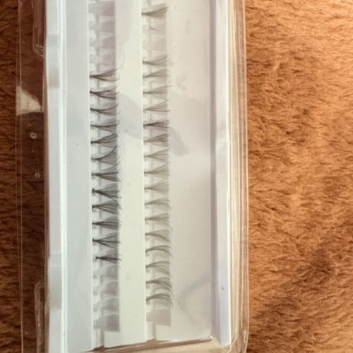 Eyelash tuferkia with adhesive used