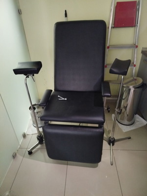 Medical phlebotomy chair used with replaced upholstery