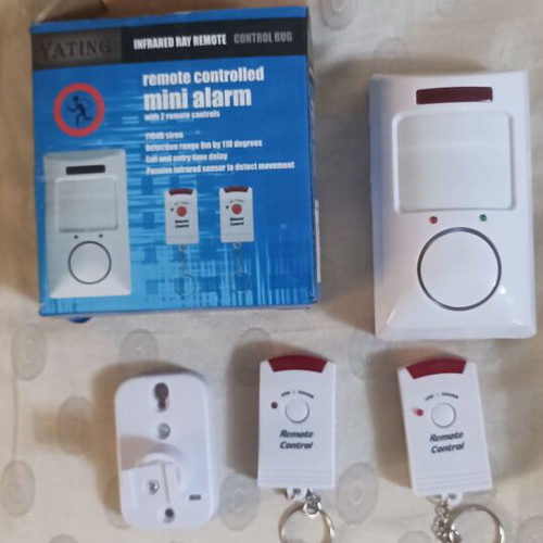Mini Alarm like new with two remote controls and mounting bracket