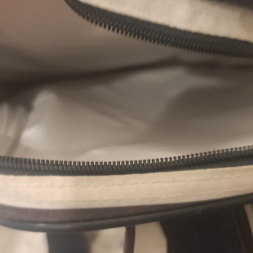 Insulated backpack with bottle holder like new, black and white striped