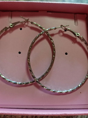 Hoop earrings with embossed design silver like new