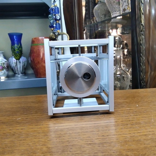 Quartz table clock silver color rotating, like new
