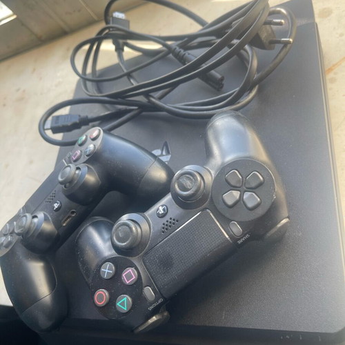 PlayStation 4 (PS4) like new with 2 controllers