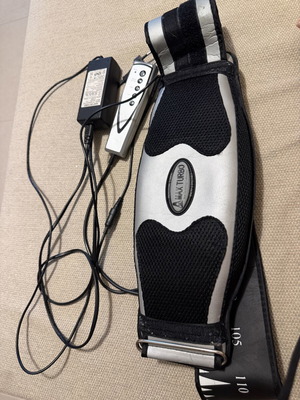 Massage belt with vibrations used for gluteal stimulation