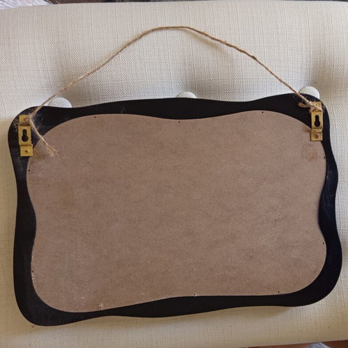 Retro cork board with wavy black wooden frame