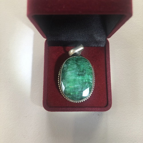Necklace of smelted emerald like new with black ribbon