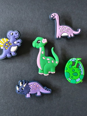 Crocs charms set with dinosaurs like new, multicolored