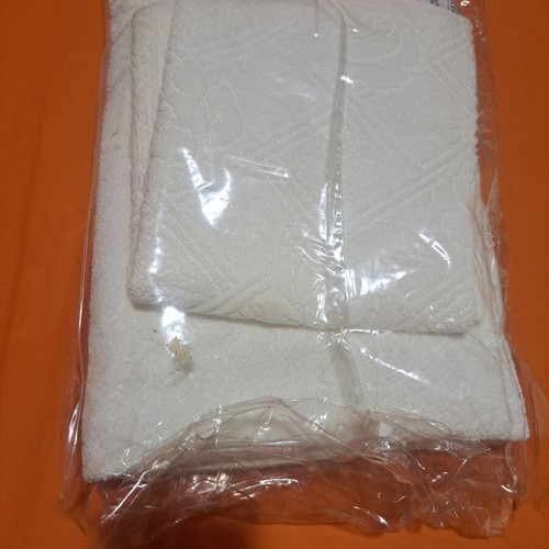 Towel set white 2 pieces new, face embossed and plain body