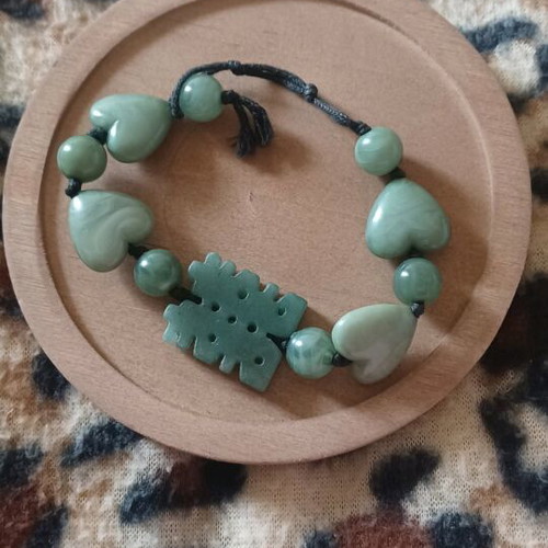 Bracelet with green stones, hearts and luck symbol like new