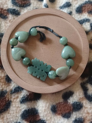 Bracelet with green stones, hearts and luck symbol like new