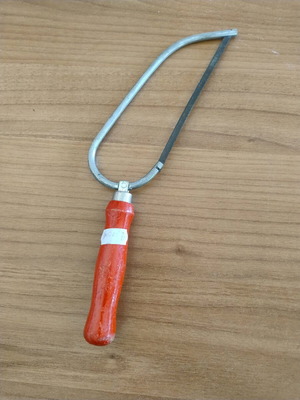 Hand saw used with red wooden handle, 14.5 cm blade length
