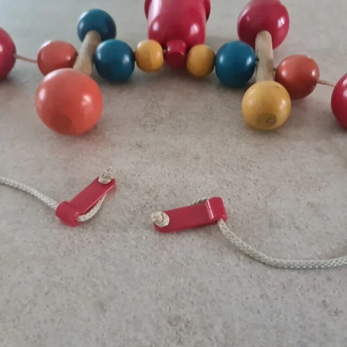 Vintage wooden stroller toy.