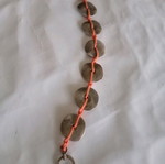 Handmade bracelet with orange cord