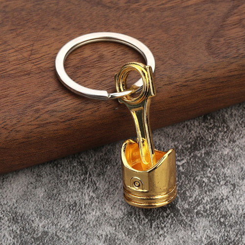 Car piston keychain, gold color