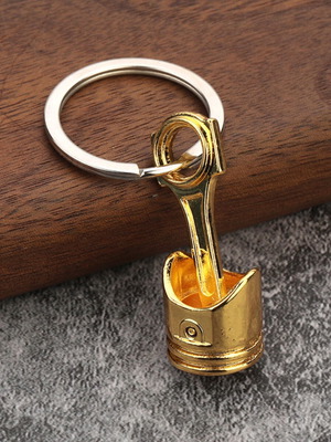 Car piston keychain, gold color