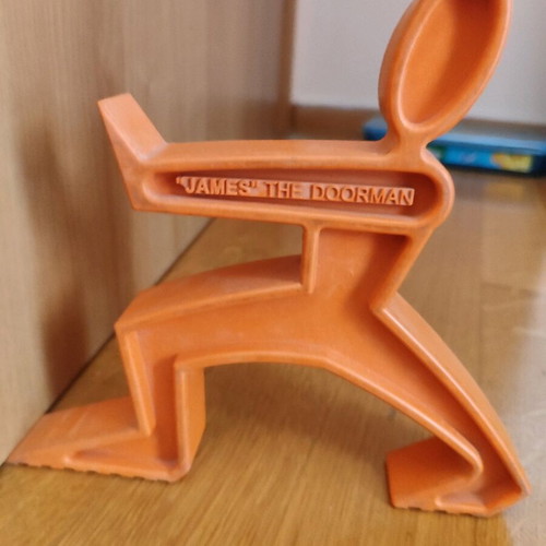 Doorstop "James the Doorman" like new, orange