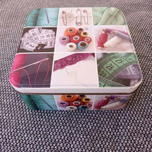 Sewing kit metal box with useful sewing items used