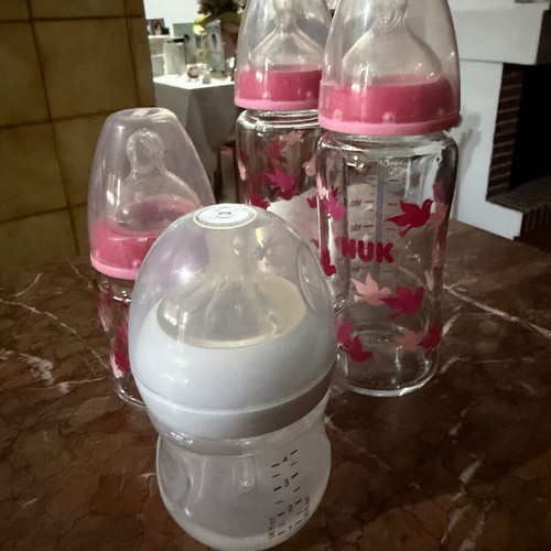 4 baby feeding bottles, 3 glass NUK, 1 plastic Philips