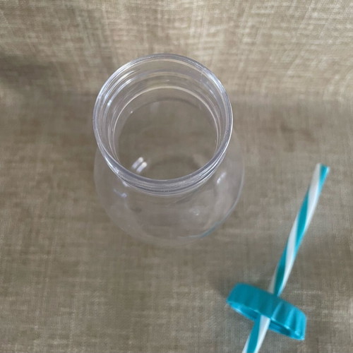 Plastic Transparent Bottle with Straw and Emoji Face Used