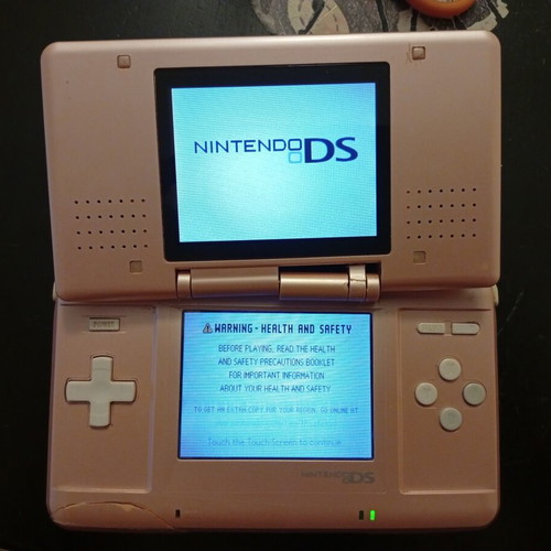 Nintendo DS console Metallic Rose used for repair or parts