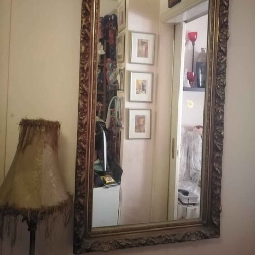 Antique mirror used with carved frame in gold crackle finish