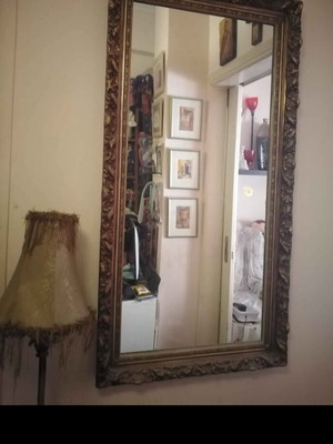 Antique mirror used with carved frame in gold crackle finish