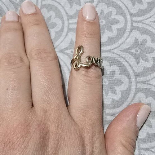 Love ring in gold tone like new