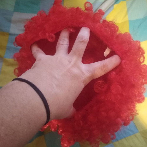 Orange carnival wig used with curly hair