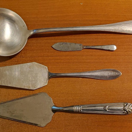 Set of used bronze ladle and spatulas