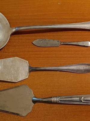 Set of used bronze ladle and spatulas