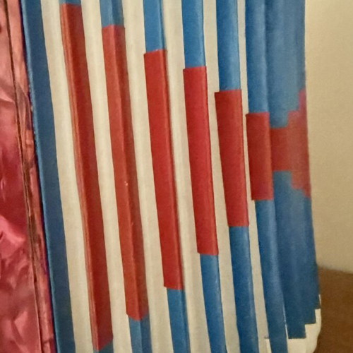 Children's accordion used, red with blue and red bellows