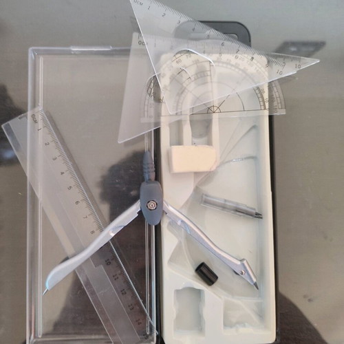 Geometry set like new with compass, protractor, ruler, and pencil
