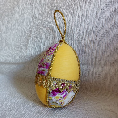 Decorative yellow floral egg used for Easter and spring decor