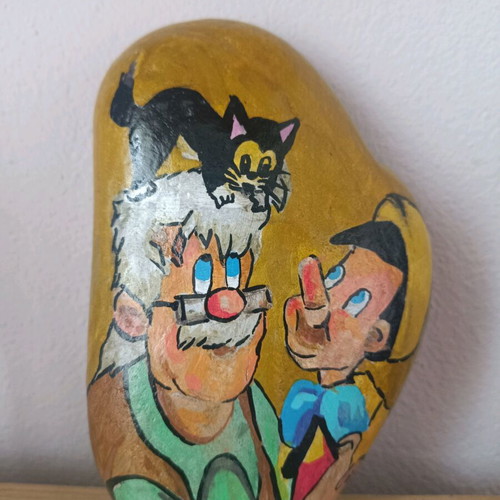 Painted stone new with acrylic colors and glossy varnish