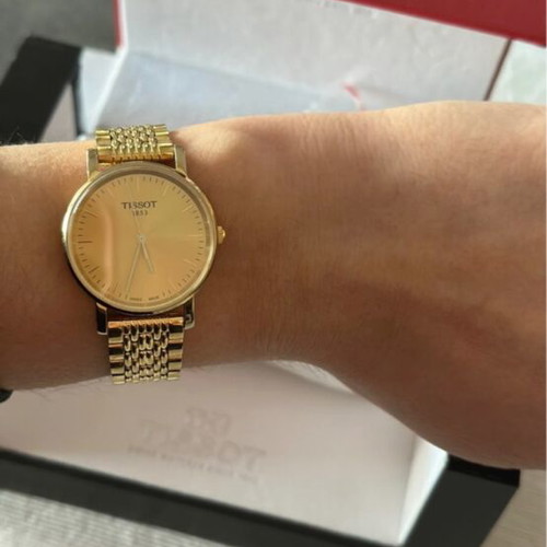 Tissot gold watch
