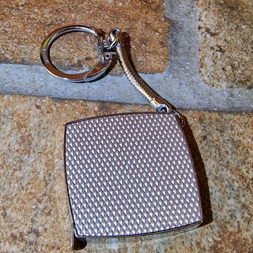 BP vintage keychain tape measure used