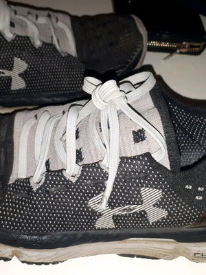 Under Armour athletic shoes used, black and gray, sizes 37-38