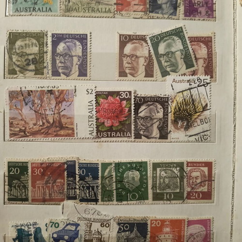 Stamp album like new with about 500 mostly foreign stamps