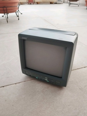 Small portable black and white SONIC TV used with antenna