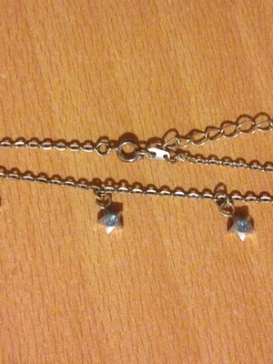 Silver bracelet with stars and blue rhinestones used