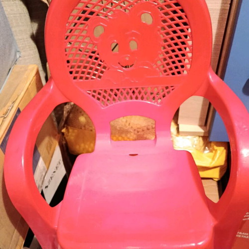 Children's chair used, red plastic with arms and Minnie design