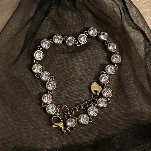 Gold bracelet with white stones like new