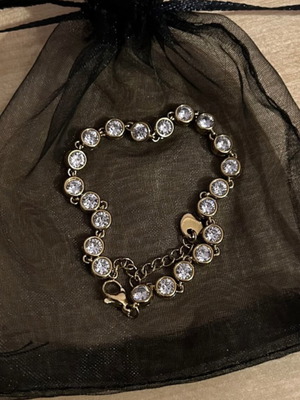Gold bracelet with white stones like new