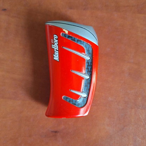 Set of 2 vintage collectible lighters, grey metal and red racing