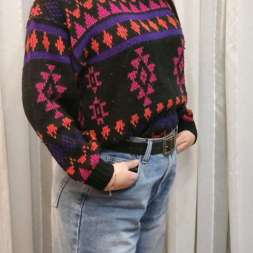 Black sweater with patterns used, multicolored