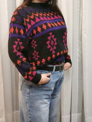 Black sweater with patterns used, multicolored