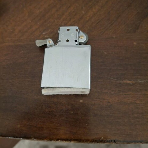 Custom Zippo lighter with handcrafted wooden tribal sun design