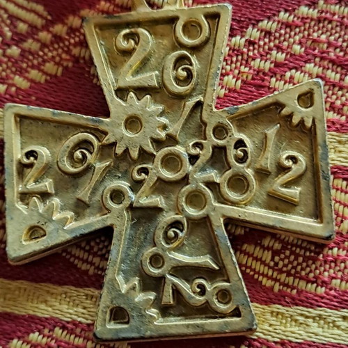 Collectible cross 2012 used with red bead decoration